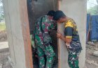 Plester Dinding MCK Dikebut, Satgas TMMD ke-129 Pastikan Program Pembangunan di Wanam Terus Berjalan
